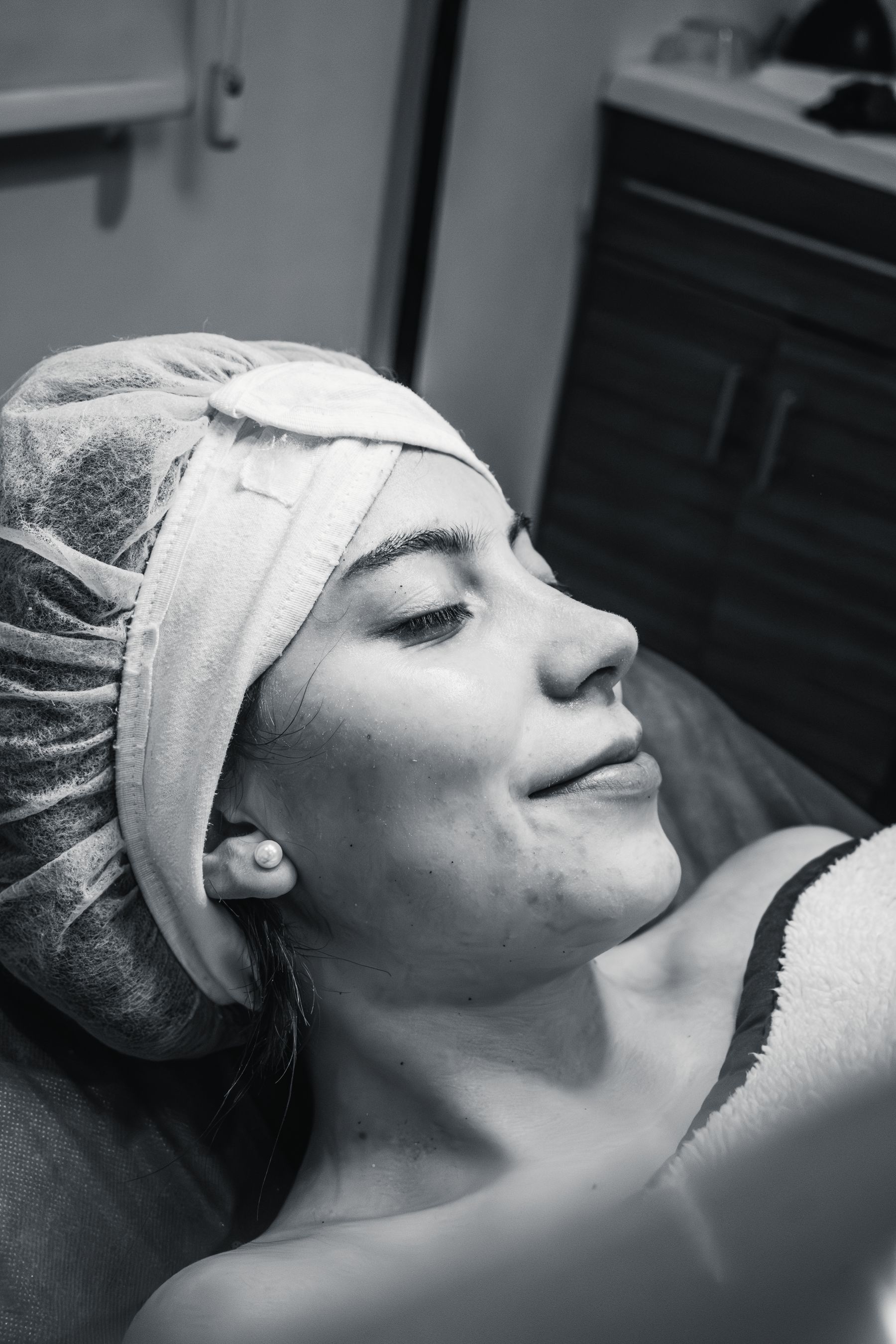 Woman relaxing with eyes closed during a spa treatment