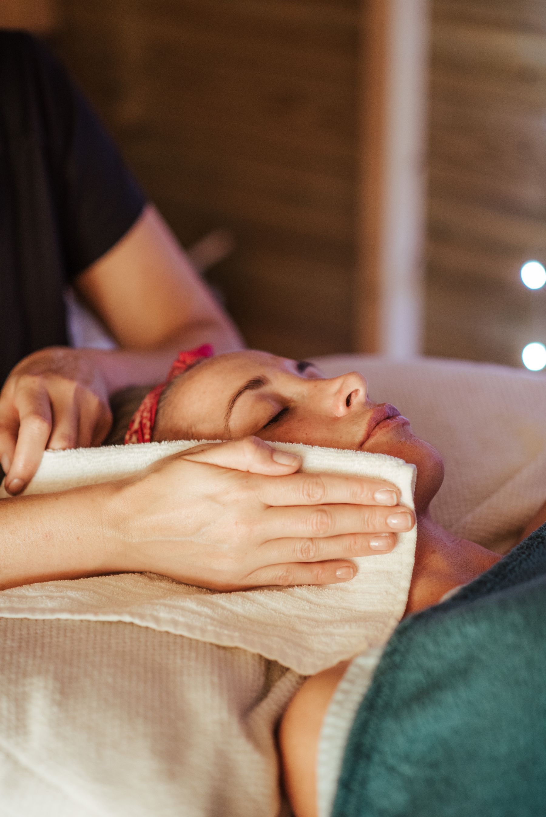 Client relaxing during a facial treatment
